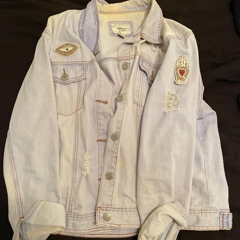 Distressed patched denim jacket